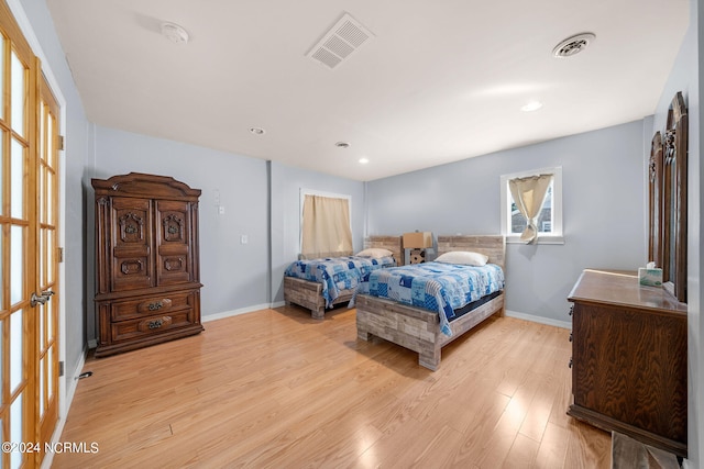 bedroom with light wood-type flooring