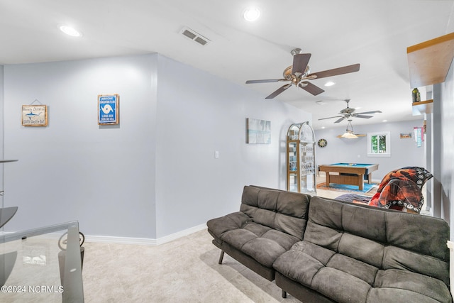 carpeted living room featuring ceiling fan and pool table