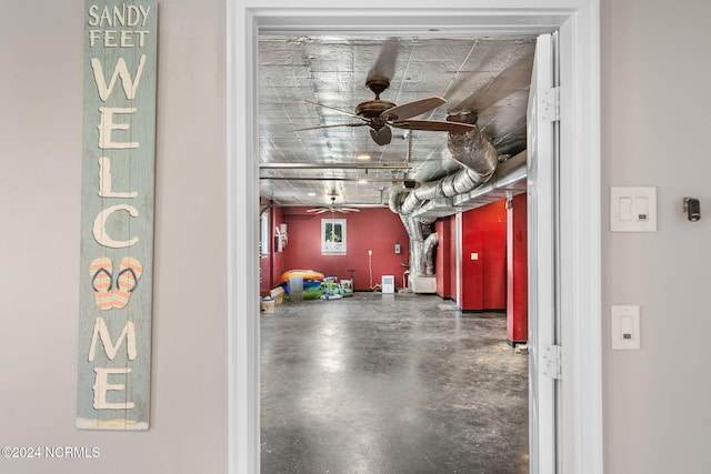 interior space with ceiling fan