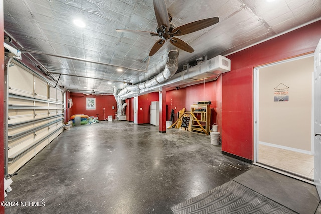 garage featuring white fridge and ceiling fan