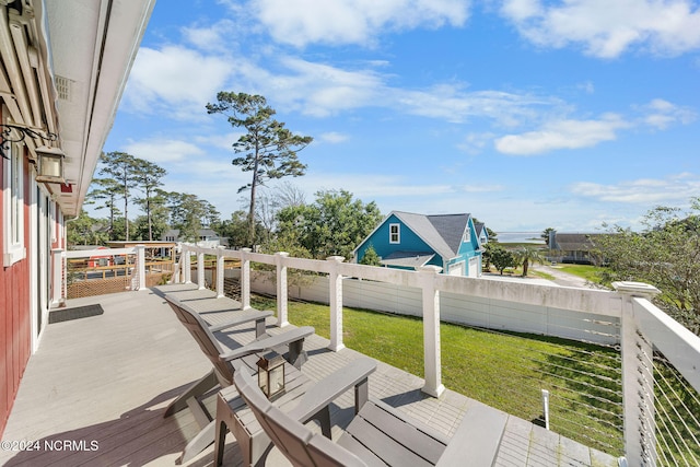 wooden terrace with a yard