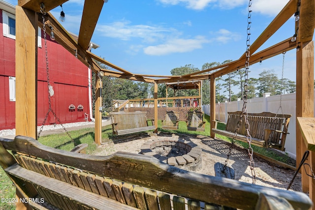 view of patio / terrace featuring an outdoor fire pit