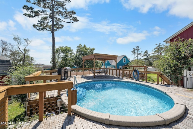 view of pool featuring a gazebo and a deck