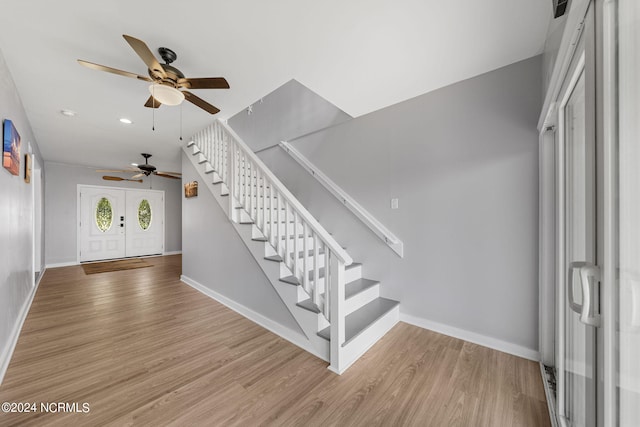 foyer entrance featuring ceiling fan and light hardwood / wood-style flooring