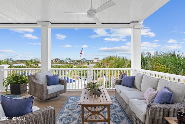 deck featuring outdoor lounge area and ceiling fan