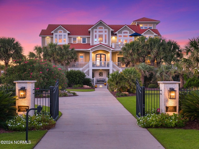 view of front facade with a porch and a yard