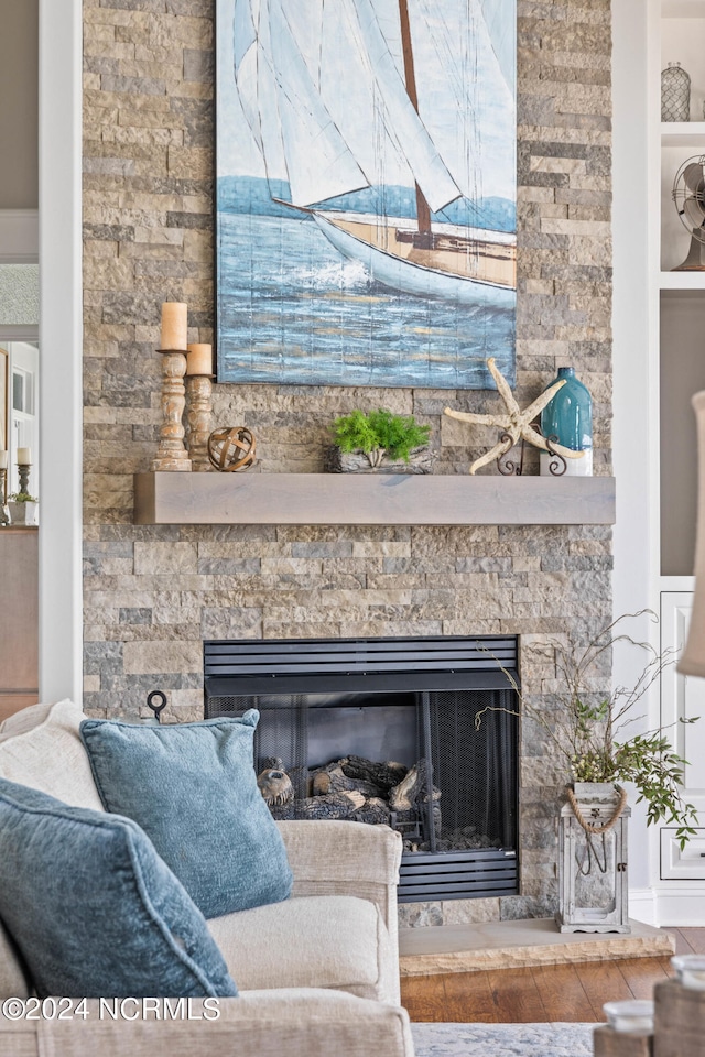 interior details featuring hardwood / wood-style flooring and a fireplace