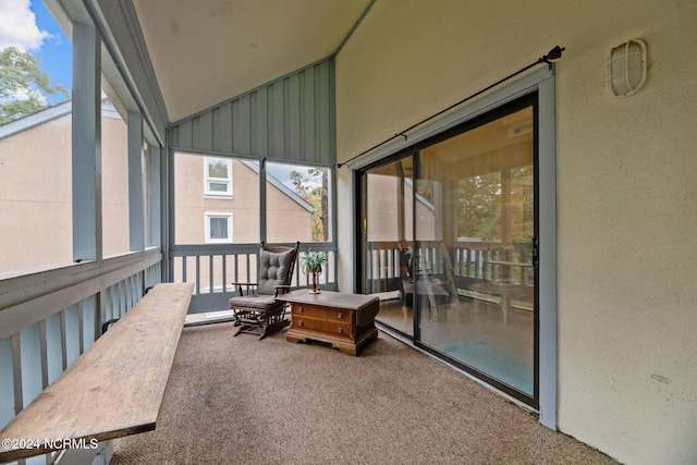 sunroom with lofted ceiling