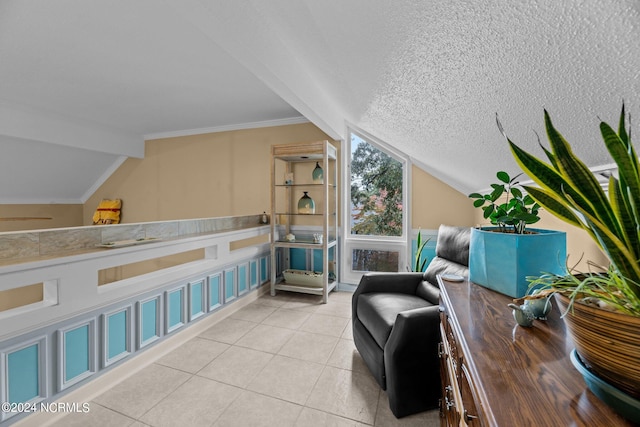 living area with ornamental molding, a textured ceiling, lofted ceiling with beams, and light tile patterned flooring