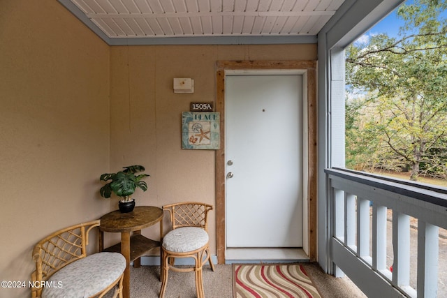 entryway featuring carpet flooring