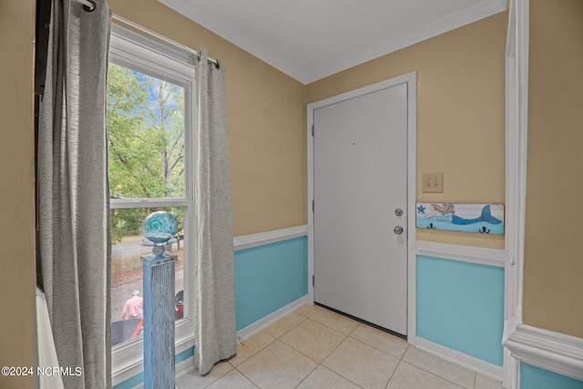 doorway to outside with crown molding and light tile patterned flooring