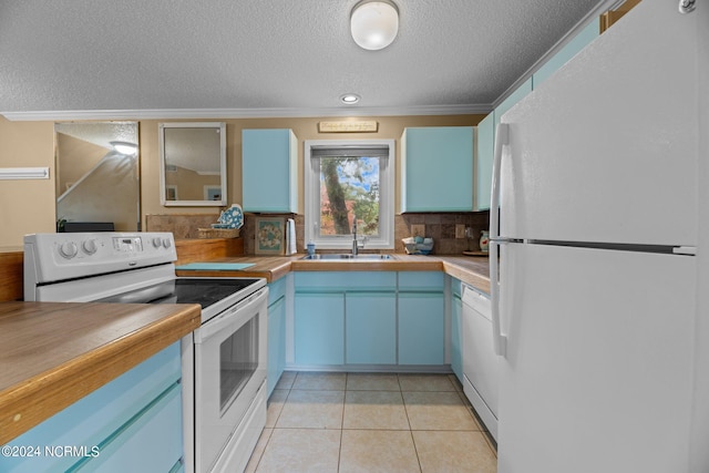 kitchen featuring white appliances, light tile patterned flooring, sink, decorative backsplash, and ornamental molding