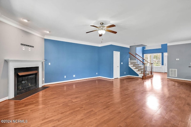 unfurnished living room with ceiling fan, hardwood / wood-style floors, and ornamental molding