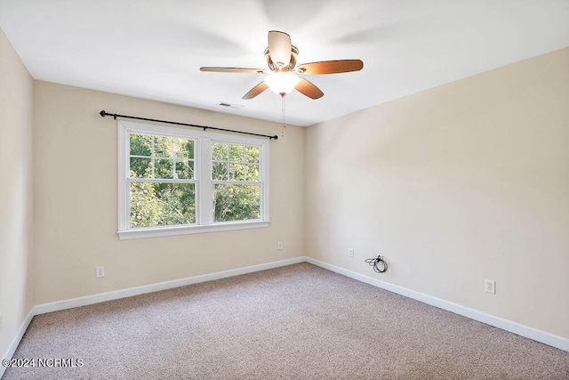 carpeted empty room with ceiling fan