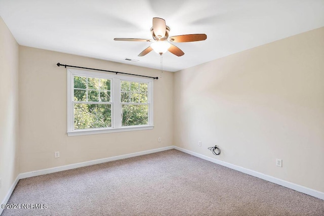 4301 Peeble Dr, Wilmington, NC 28412 - spare room featuring carpet flooring, visible vents, a ceiling fan, and baseboards