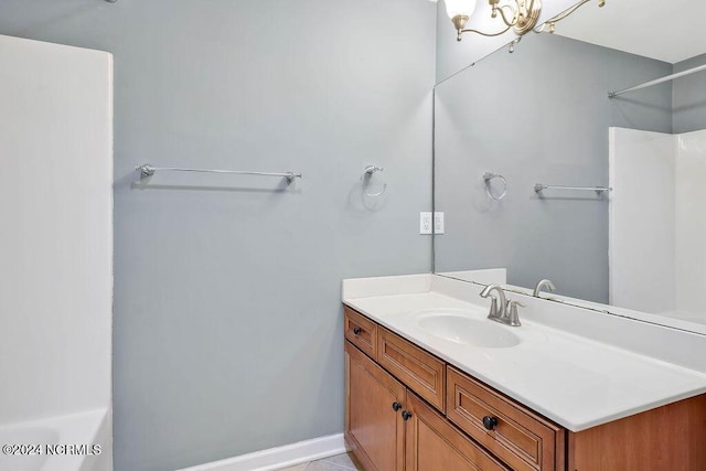 4301 Peeble Dr, Wilmington, NC 28412 - bathroom with a chandelier, walk in shower, and vanity