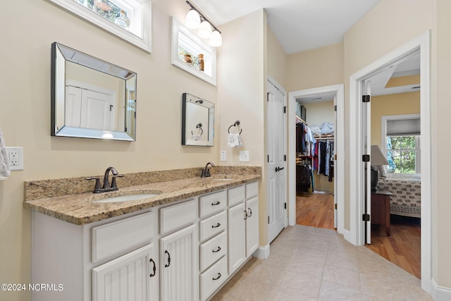 bathroom featuring hardwood / wood-style flooring and vanity