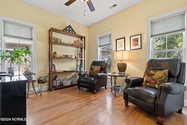 sitting room with ceiling fan, light hardwood / wood-style flooring, and plenty of natural light