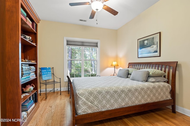 bedroom featuring ceiling fan and light hardwood / wood-style flooring