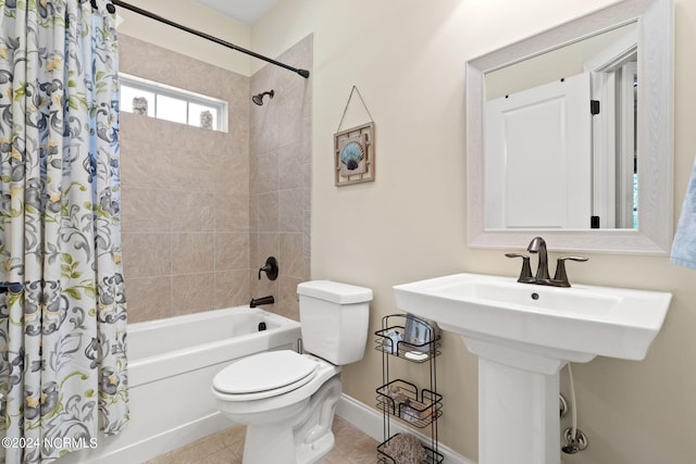 full bathroom featuring tile patterned flooring, shower / bath combo, sink, and toilet