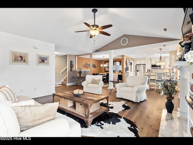 1204 Maple Ridge Rd, Wilmington, NC 28411 - living area featuring a ceiling fan, stairway, vaulted ceiling, light wood-style flooring, and ornate columns