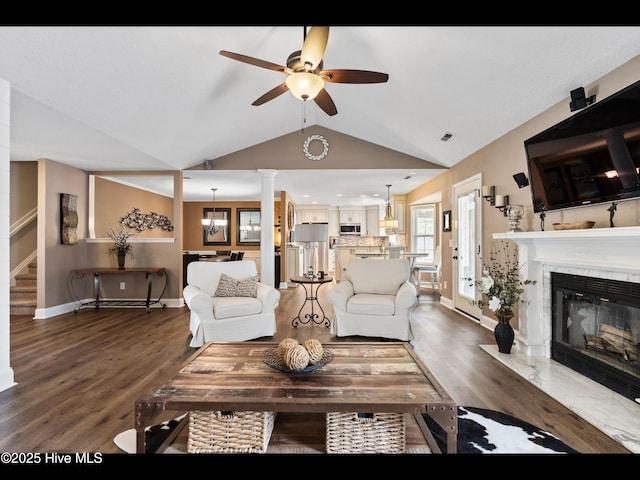 1204 Maple Ridge Rd, Wilmington, NC 28411 - living room with lofted ceiling, ceiling fan, a premium fireplace, wood finished floors, and stairs