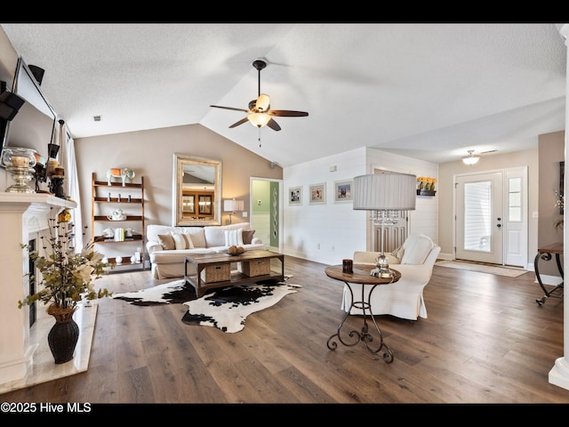 1204 Maple Ridge Rd, Wilmington, NC 28411 - living room featuring a ceiling fan, wood finished floors, lofted ceiling, and a fireplace