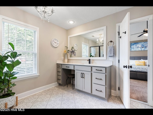 1204 Maple Ridge Rd, Wilmington, NC 28411 - ensuite bathroom with a chandelier, healthy amount of natural light, and a textured ceiling