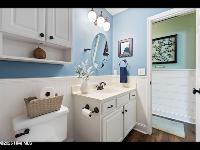 1204 Maple Ridge Rd, Wilmington, NC 28411 - bathroom featuring wainscoting, vanity, and wood finished floors