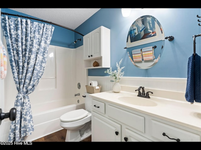 1204 Maple Ridge Rd, Wilmington, NC 28411 - full bath with shower / bathtub combination with curtain, vanity, wood finished floors, and a textured ceiling