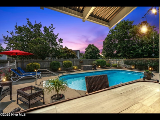 1204 Maple Ridge Rd, Wilmington, NC 28411 - pool at dusk with a patio and a fenced backyard