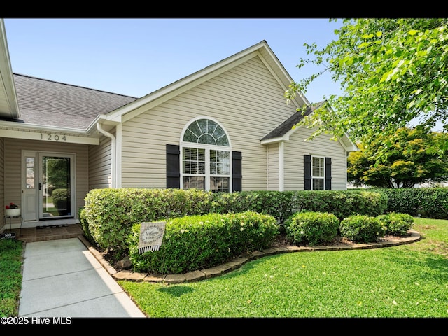 1204 Maple Ridge Rd, Wilmington, NC 28411 - view of side of property with a yard and roof with shingles