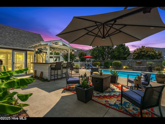 1204 Maple Ridge Rd, Wilmington, NC 28411 - patio terrace at dusk with a fenced backyard and a patio