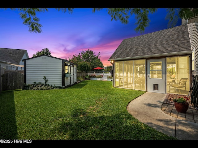 1204 Maple Ridge Rd, Wilmington, NC 28411 - fenced backyard with a sunroom and an outbuilding