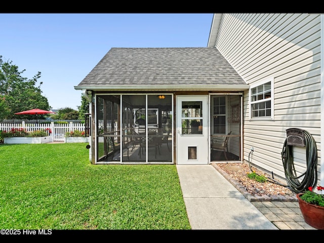 1204 Maple Ridge Rd, Wilmington, NC 28411 - rear view of house featuring a sunroom and a shingled roof
