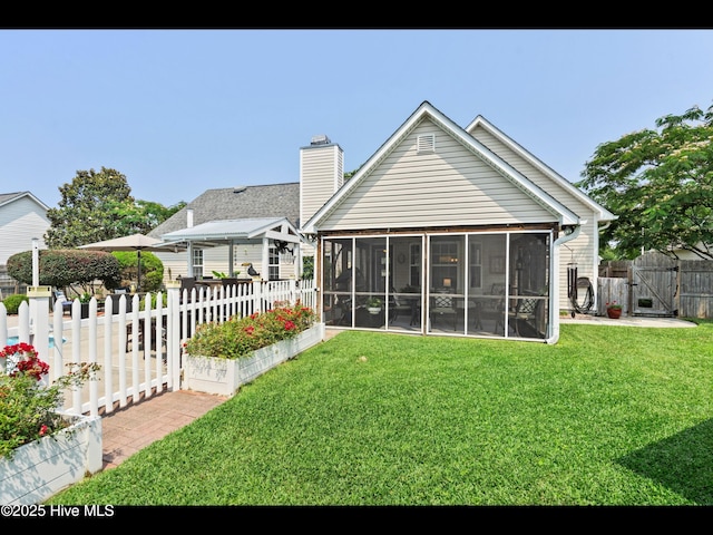 1204 Maple Ridge Rd, Wilmington, NC 28411 - back of property with a sunroom, a gate, a fenced backyard, and a chimney