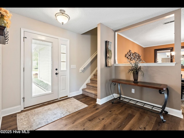 1204 Maple Ridge Rd, Wilmington, NC 28411 - foyer entrance featuring wood finished floors, a textured ceiling, and stairway