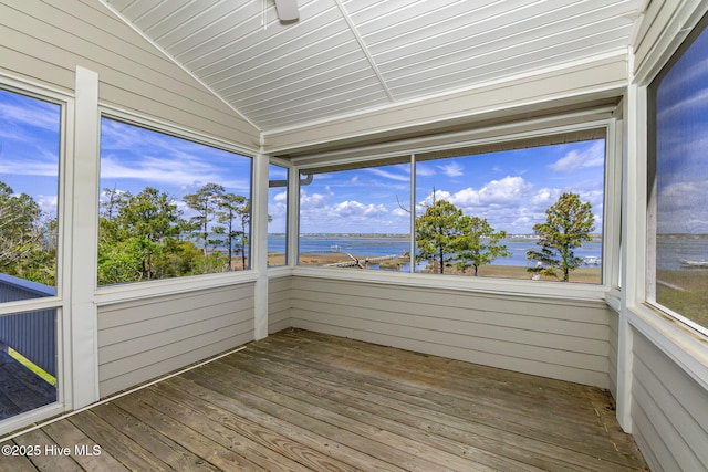10002 Coast Guard Rd, Emerald Isle, NC 28594 - unfurnished sunroom with a water view, wooden walls, lofted ceiling, wood finished floors, and plenty of natural light