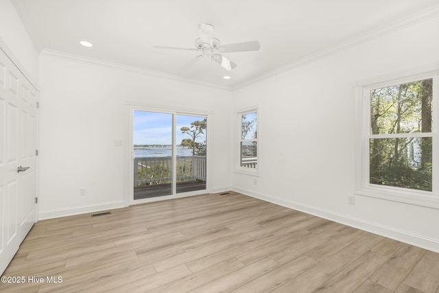 10002 Coast Guard Rd, Emerald Isle, NC 28594 - unfurnished bedroom featuring access to exterior, light wood finished floors, baseboards, ornamental molding, and recessed lighting