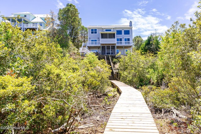 10002 Coast Guard Rd, Emerald Isle, NC 28594 - back of property with stairway and a balcony