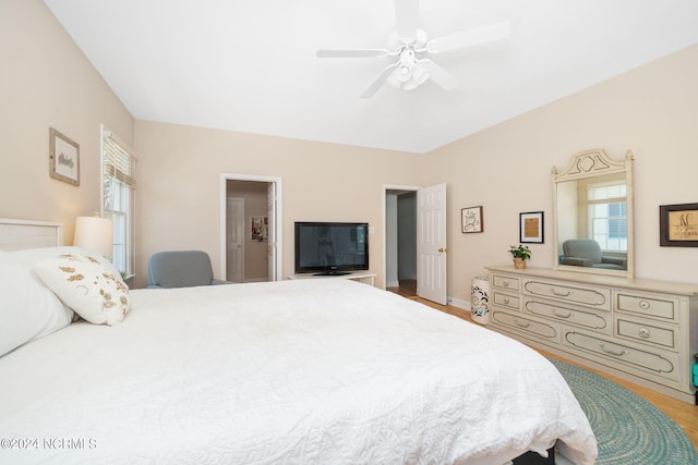 bedroom with ceiling fan and hardwood / wood-style floors