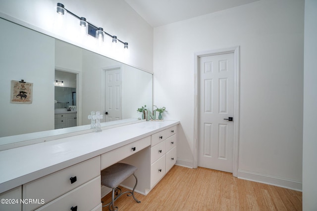 bathroom featuring vanity and hardwood / wood-style floors