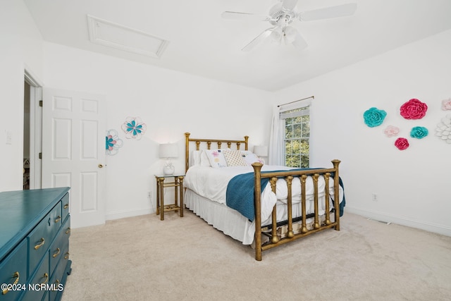 bedroom featuring light carpet and ceiling fan