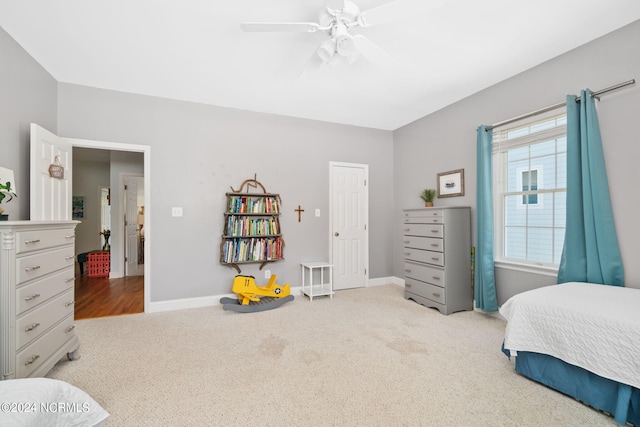 carpeted bedroom featuring ceiling fan