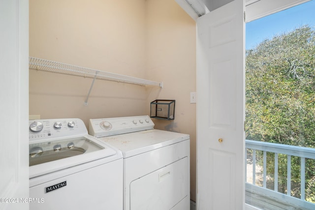 clothes washing area featuring washing machine and dryer