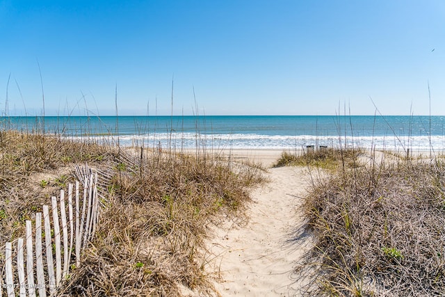 property view of water featuring a beach view