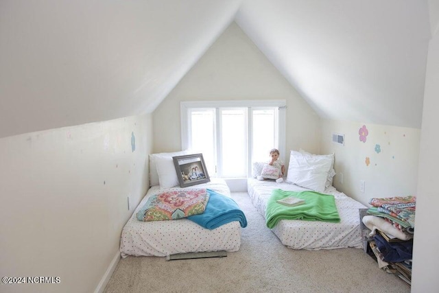 carpeted bedroom featuring vaulted ceiling