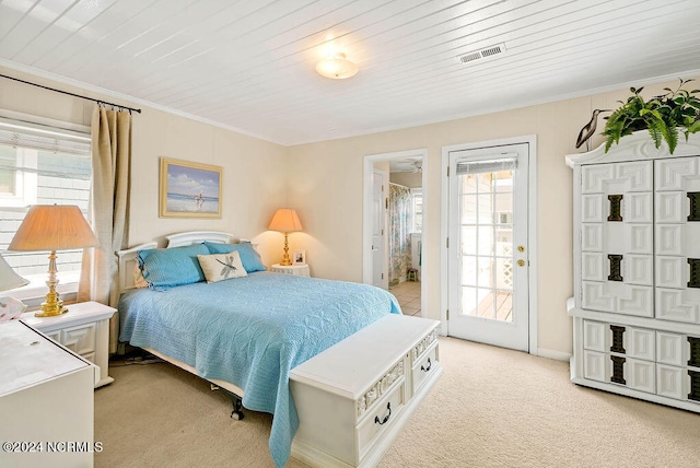 carpeted bedroom featuring wood ceiling, connected bathroom, and ornamental molding