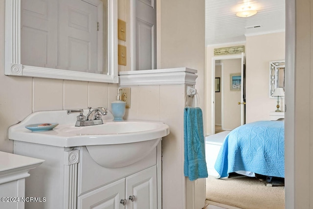 bathroom featuring vanity and tasteful backsplash