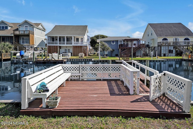 view of dock with a deck with water view